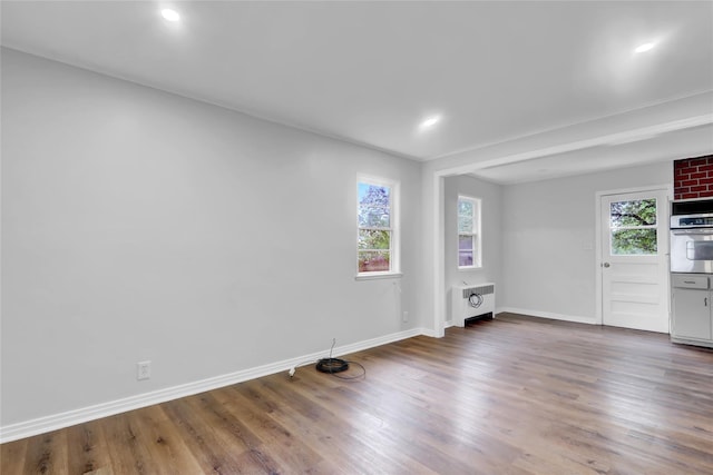30 Inwood Rd, Glen Cove, NY 11542 - unfurnished room featuring recessed lighting, wood finished floors, baseboards, and radiator heating unit