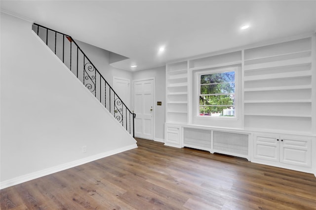 30 Inwood Rd, Glen Cove, NY 11542 - foyer entrance featuring baseboards, stairs, radiator, and wood finished floors