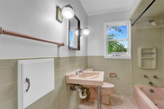 30 Inwood Rd, Glen Cove, NY 11542 - full bathroom featuring toilet, washtub / shower combination, a wainscoted wall, tile walls, and tile patterned flooring