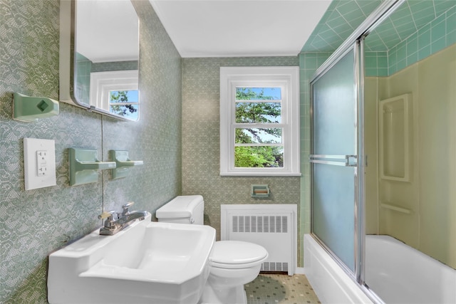 30 Inwood Rd, Glen Cove, NY 11542 - full bath featuring a sink, toilet, plenty of natural light, and radiator heating unit