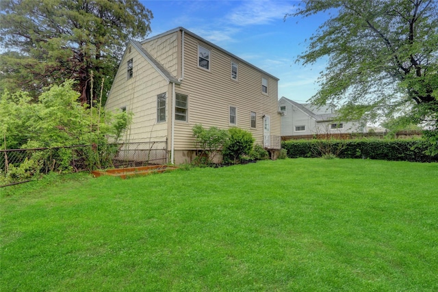 30 Inwood Rd, Glen Cove, NY 11542 - back of property featuring a lawn and fence