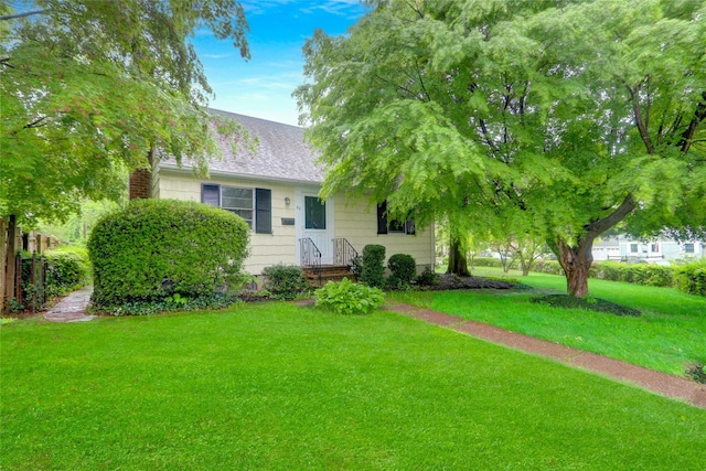 30 Inwood Rd, Glen Cove, NY 11542 - view of front facade with a front lawn and roof with shingles
