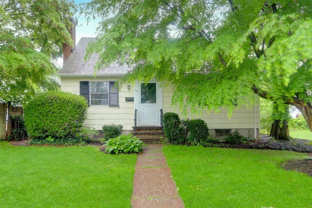 30 Inwood Rd, Glen Cove, NY 11542 - view of front facade with entry steps, a front lawn, a chimney, and a shingled roof