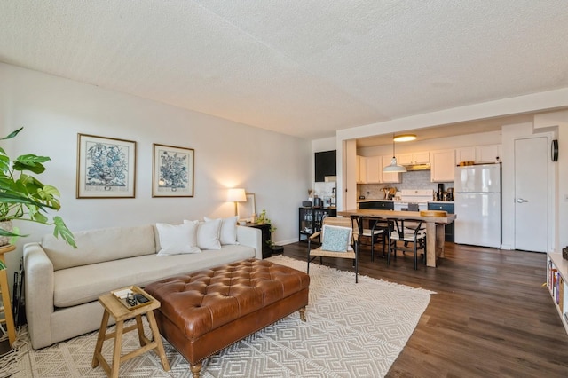 260 Bch 81st St Unit 5T, Rockaway Beach, NY 11693 - living room featuring a textured ceiling and wood finished floors