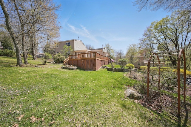 view of yard featuring stairs and a wooden deck