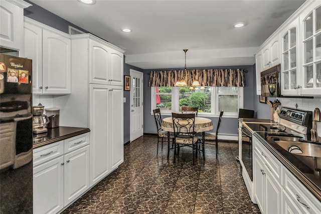 31 Elmwood Ct, Plainview, NY 11803 - kitchen featuring black appliances, dark countertops, glass insert cabinets, white cabinetry, and recessed lighting