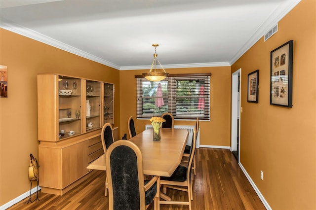 31 Elmwood Ct, Plainview, NY 11803 - dining area featuring dark wood-style flooring, crown molding, and baseboards