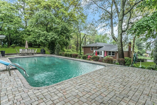 31 Elmwood Ct, Plainview, NY 11803 - outdoor pool with a patio area and outdoor dining space