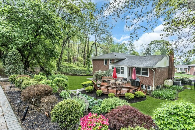 31 Elmwood Ct, Plainview, NY 11803 - rear view of house featuring a deck, central AC unit, a chimney, and brick siding