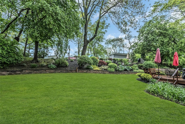 31 Elmwood Ct, Plainview, NY 11803 - view of green lawn with a wooden deck