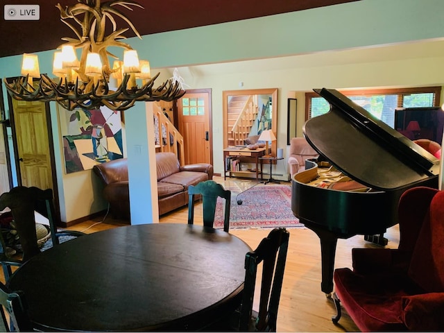 117 Dusinberre Rd, Gardiner, NY 12525 - dining room featuring an inviting chandelier, wood finished floors, and stairway