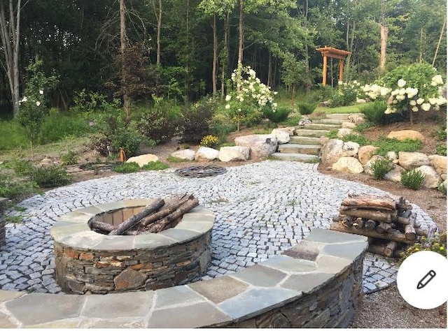 117 Dusinberre Rd, Gardiner, NY 12525 - view of yard featuring a patio, a wooded view, and an outdoor fire pit