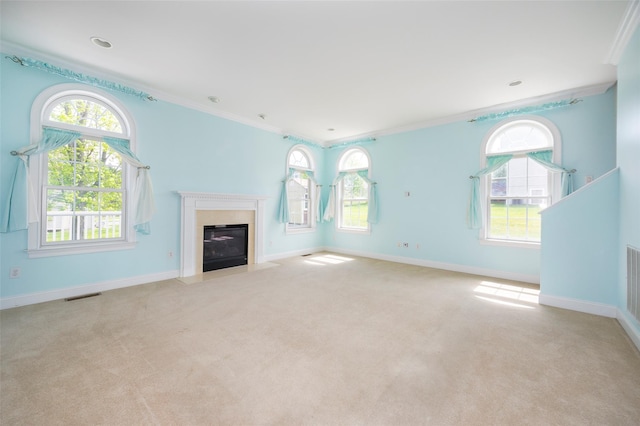 unfurnished living room featuring carpet floors, ornamental molding, baseboards, and visible vents