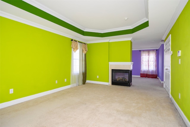 unfurnished living room featuring crown molding, baseboards, carpet floors, and a multi sided fireplace