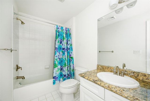 bathroom with visible vents, vanity, tile patterned floors, toilet, and shower / bath combo with shower curtain
