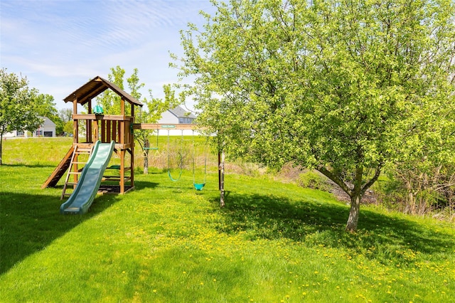 view of playground with a yard