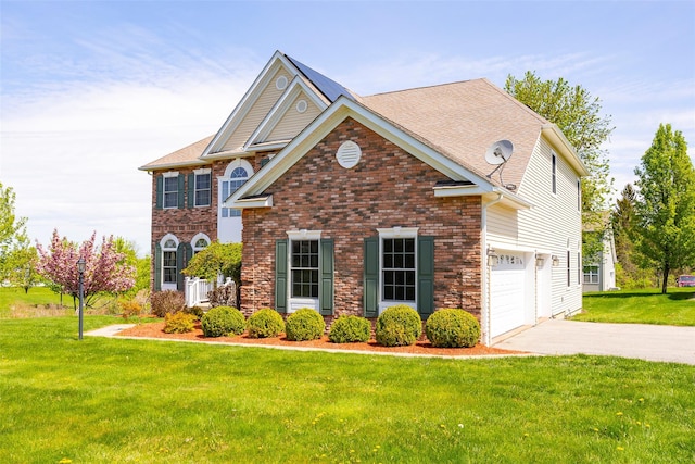 view of front of property featuring a garage, a front lawn, roof with shingles, and driveway