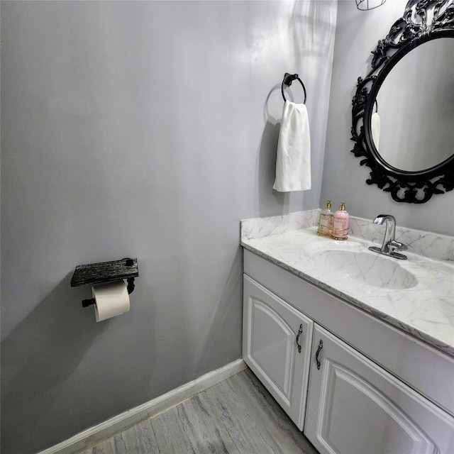 bathroom featuring vanity and baseboards