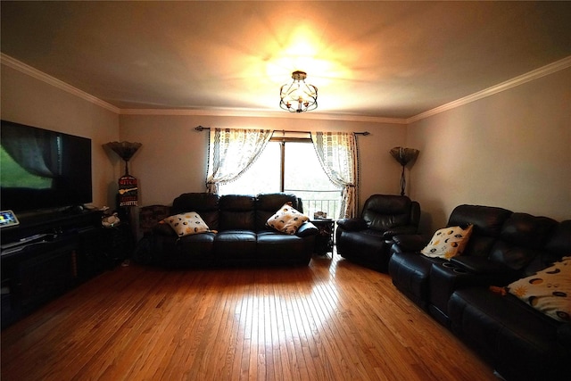 living area featuring ornamental molding and hardwood / wood-style flooring