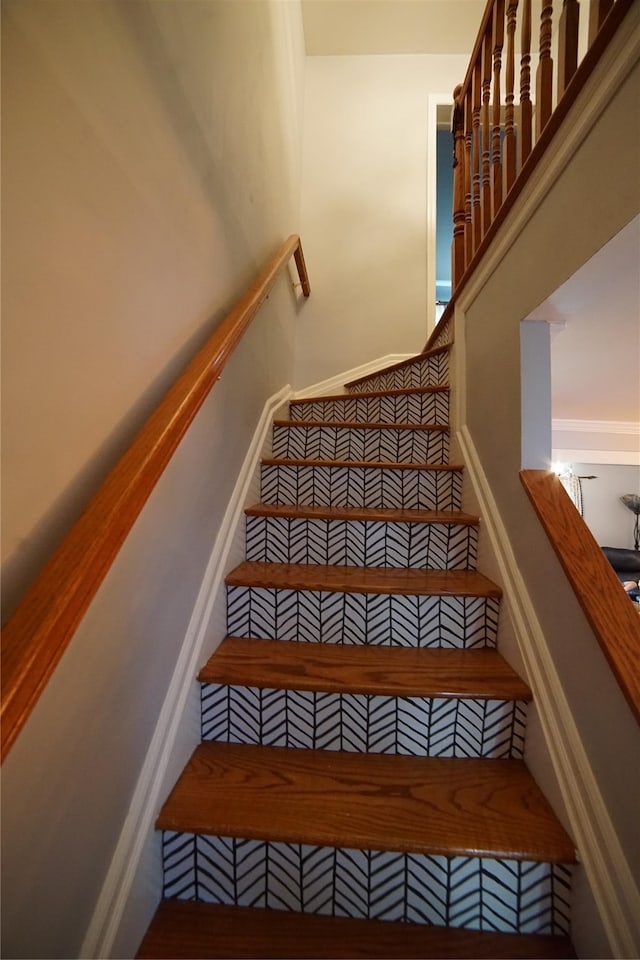 stairs featuring carpet