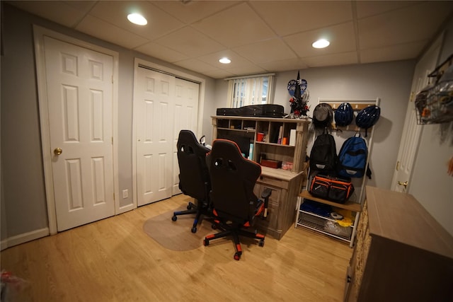 office with recessed lighting, a drop ceiling, and wood finished floors