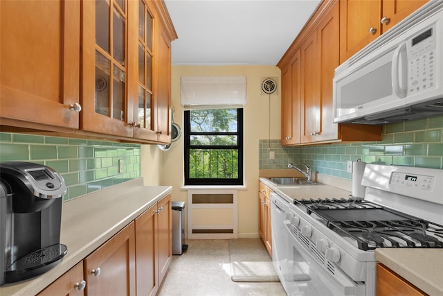 51 Rockledge Rd Unit 1A, Hartsdale, NY 10530 - kitchen featuring white appliances, brown cabinetry, light countertops, and decorative backsplash