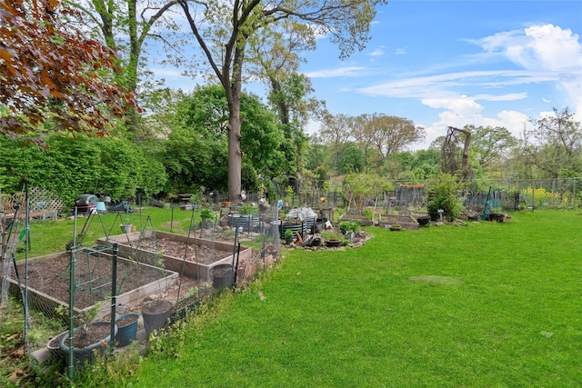 51 Rockledge Rd Unit 1A, Hartsdale, NY 10530 - view of yard with a vegetable garden and view of wooded area