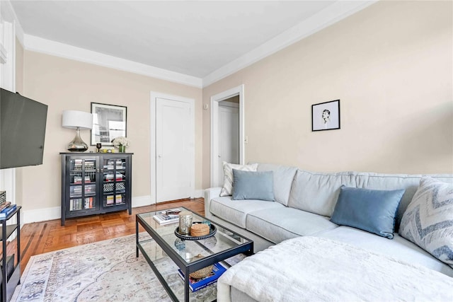 living area featuring crown molding and baseboards