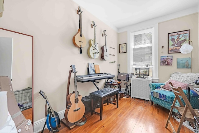 sitting room featuring light wood-style floors and baseboards