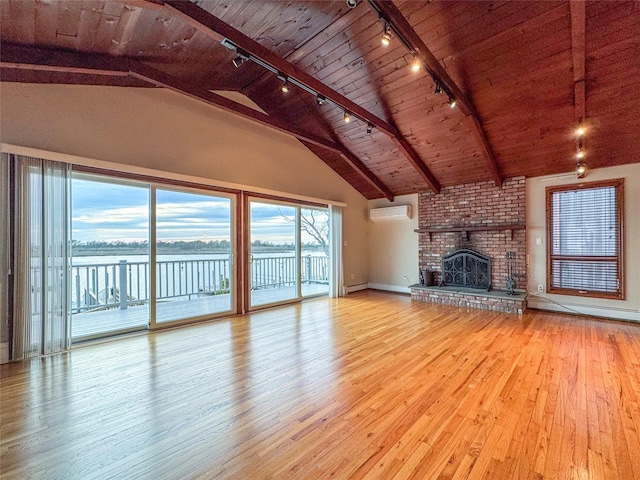 208 Block Ln, Harbor Isle, NY 11558 - unfurnished living room featuring rail lighting, an AC wall unit, wood-type flooring, wooden ceiling, and a water view