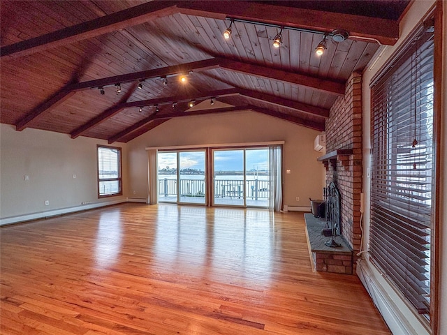 208 Block Ln, Harbor Isle, NY 11558 - unfurnished living room with light wood-style flooring, wood ceiling, a fireplace, track lighting, and baseboards
