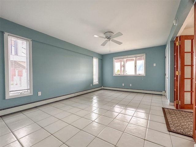 208 Block Ln, Harbor Isle, NY 11558 - unfurnished room featuring a baseboard heating unit, ceiling fan, light tile patterned flooring, and baseboards