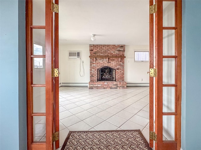 208 Block Ln, Harbor Isle, NY 11558 - unfurnished living room with baseboard heating, light tile patterned flooring, a baseboard heating unit, and a brick fireplace
