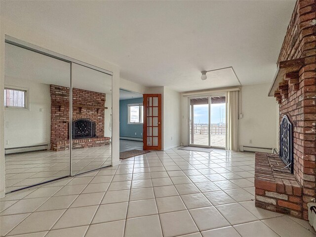208 Block Ln, Harbor Isle, NY 11558 - unfurnished living room featuring a fireplace, a baseboard heating unit, light tile patterned flooring, and baseboard heating
