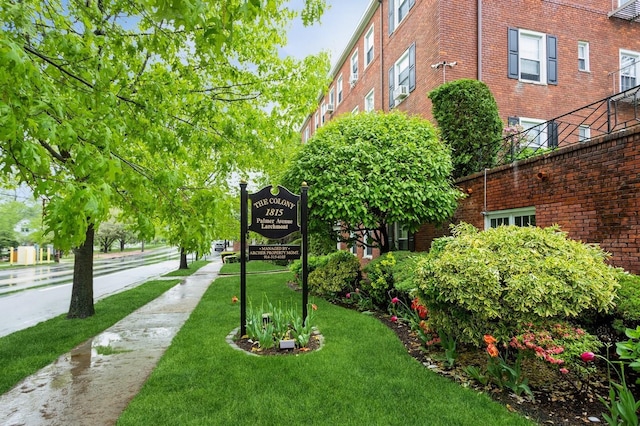 view of property's community featuring a yard