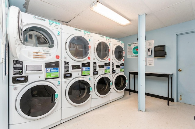 shared laundry room with stacked washer / dryer, tile patterned floors, and separate washer and dryer