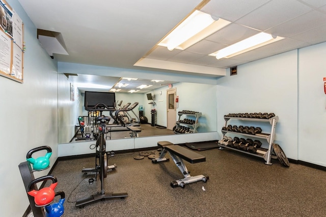 workout area featuring baseboards