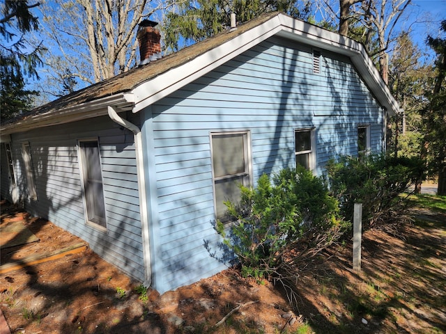 view of home's exterior with a chimney