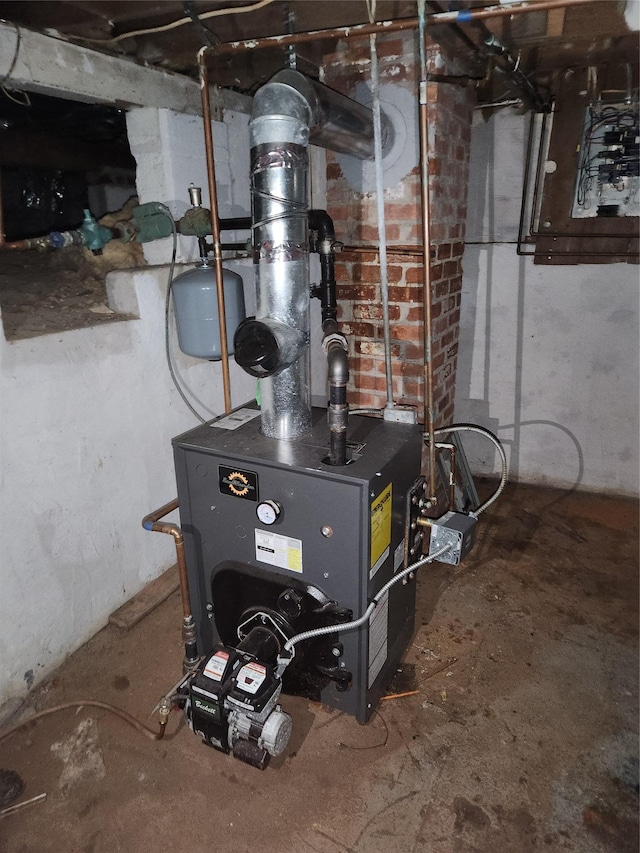 utility room featuring a heating unit