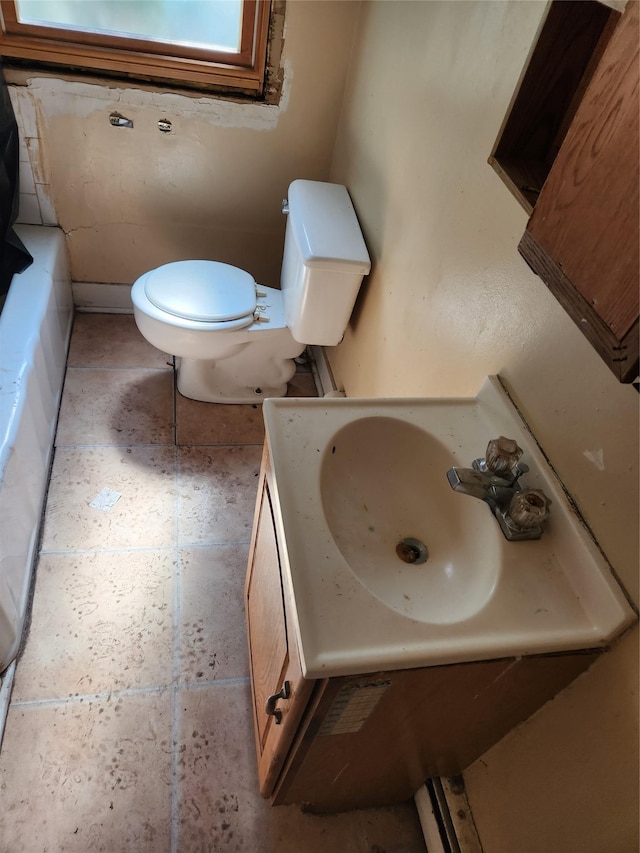 full bath featuring toilet and vanity
