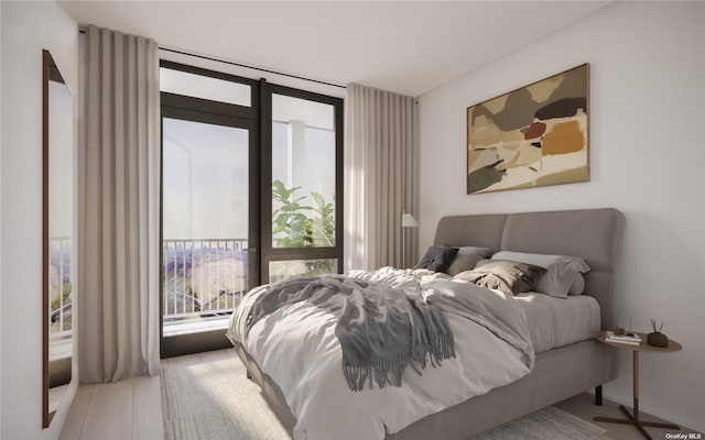 bedroom featuring access to outside and wood finished floors