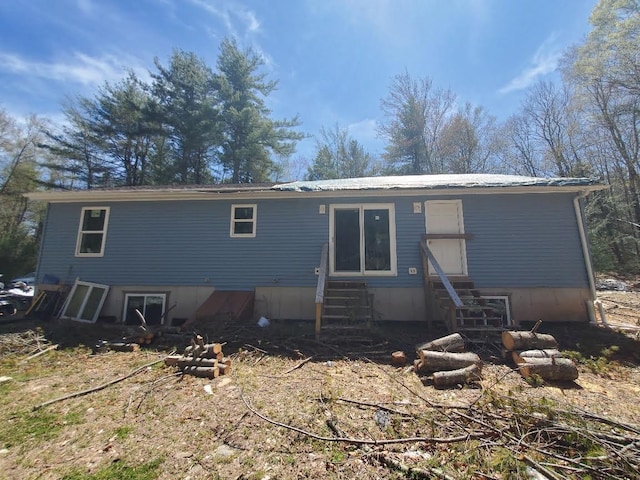 back of house featuring entry steps