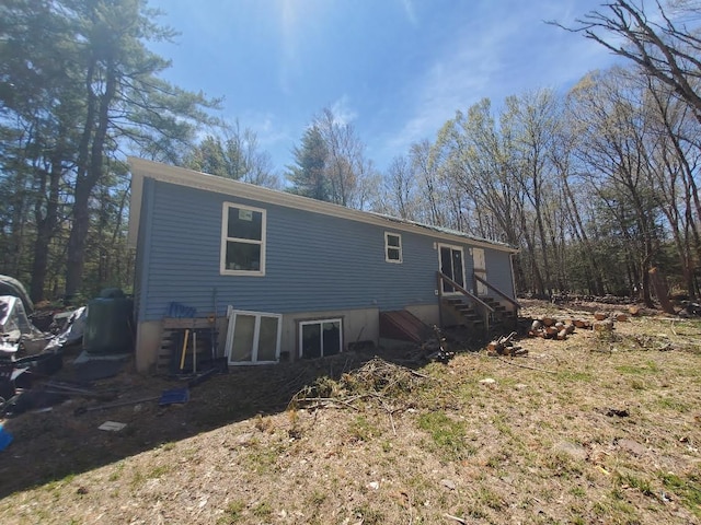 back of house featuring entry steps