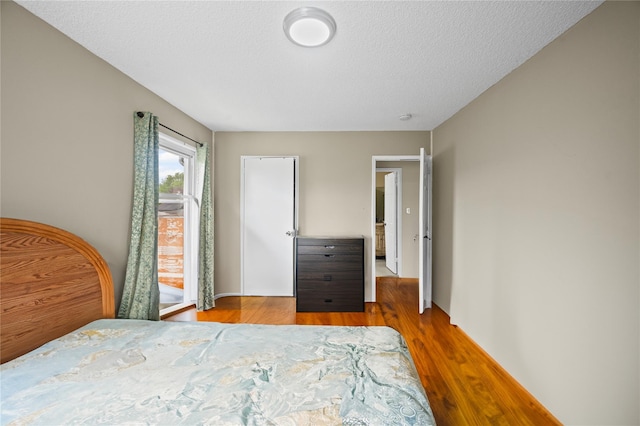 211 Cantiague Rock Rd, Westbury, NY 11590 - bedroom with wood finished floors