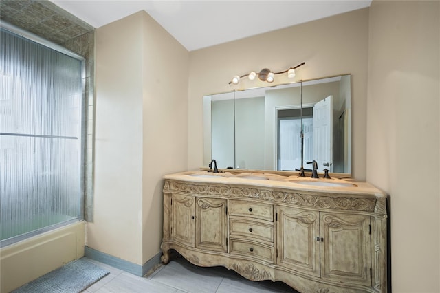 211 Cantiague Rock Rd, Westbury, NY 11590 - full bathroom featuring a sink, tile patterned floors, shower / bath combination with glass door, double vanity, and baseboards