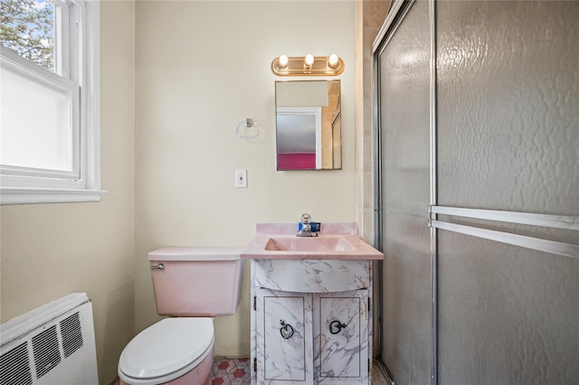 211 Cantiague Rock Rd, Westbury, NY 11590 - bathroom featuring radiator, plenty of natural light, toilet, and vanity