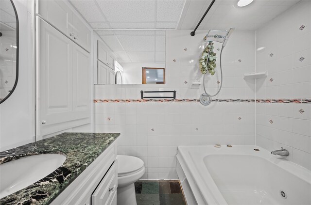 211 Cantiague Rock Rd, Westbury, NY 11590 - full bath with tile walls, toilet, vanity, a drop ceiling, and tub / shower combination