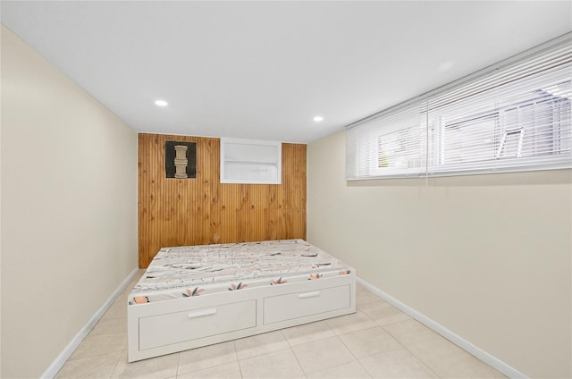 211 Cantiague Rock Rd, Westbury, NY 11590 - bedroom featuring light tile patterned floors, wood walls, baseboards, and recessed lighting