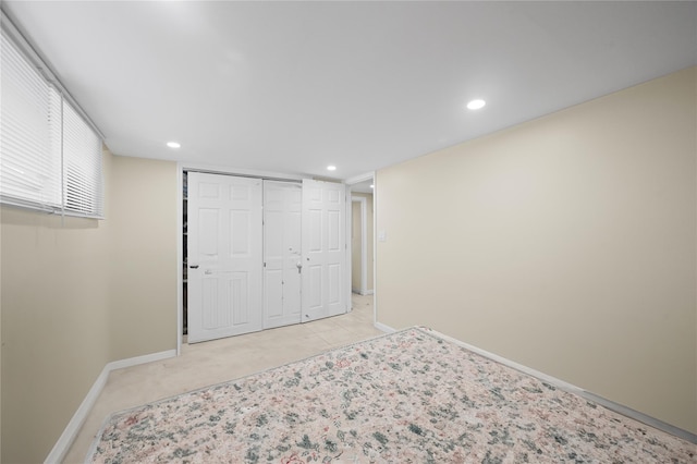 211 Cantiague Rock Rd, Westbury, NY 11590 - unfurnished bedroom featuring a closet, baseboards, and recessed lighting