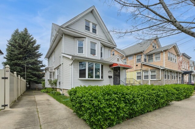 84-52 123rd St, Kew Gardens, NY 11415 - view of front of home with fence